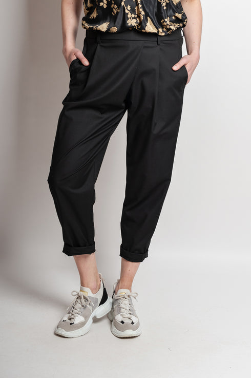 Pantaloni asimmetrici a pieghe Margret